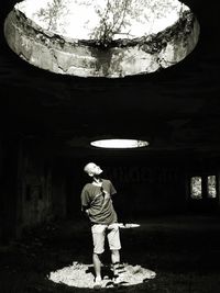 Full length of boy standing in water