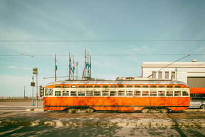 Train on railroad track against sky