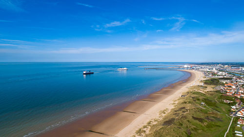 High angle view of sea against blue sky