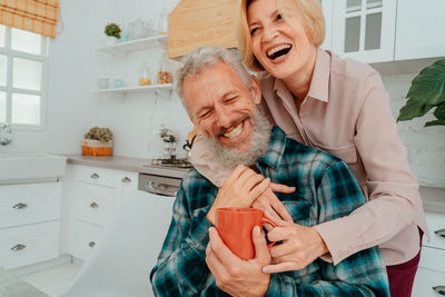 Couple embracing at home