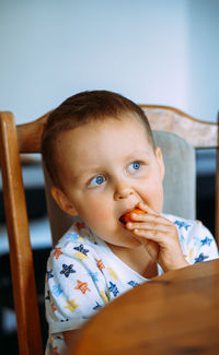 Portrait of boy eating food