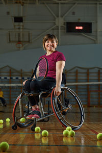 Portrait of young woman exercising in gym