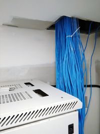 High angle view of cables on table against wall at home