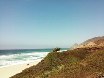 Scenic view of sea against clear blue sky