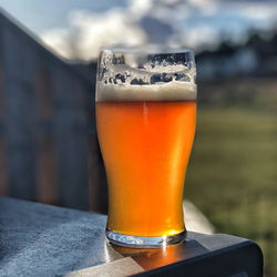 Close-up of beer glass on table