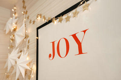 Close-up of christmas decorations hanging on ceiling