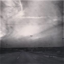 Cars on road against sky