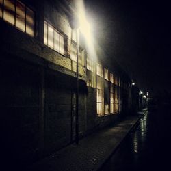 Empty illuminated street lights at night