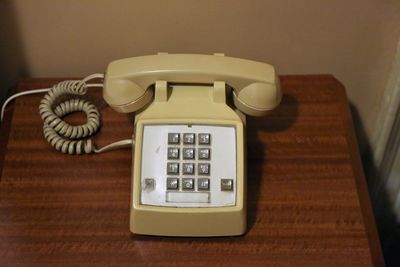 Close-up of telephone booth on table