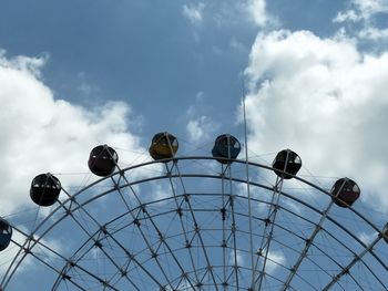 Low angle view of ferris wheel against sky