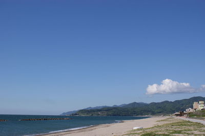 View of beach against blue sky