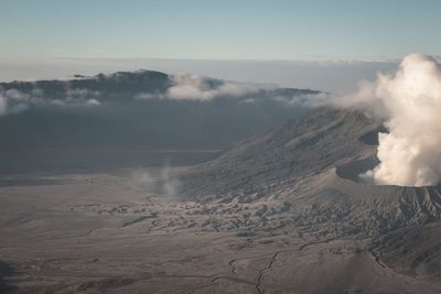 Scenic view of volcanic crater against sky