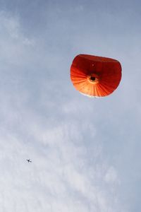 Low angle view of airplane flying in sky