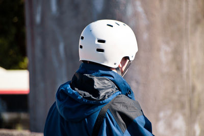 Man wearing cycling helmet on sunny day