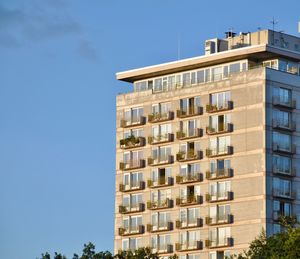 Low angle view of building against clear blue sky