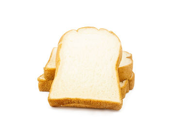 Close-up of fresh bread against white background