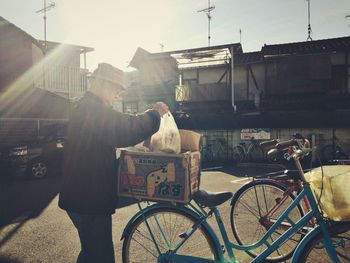 Man riding bicycle on city street