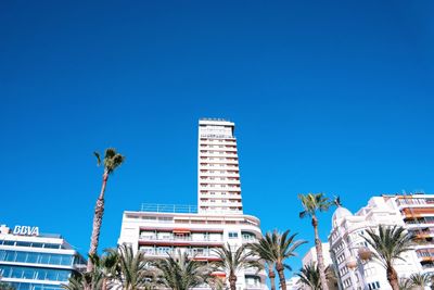 Low angle view of building against clear blue sky