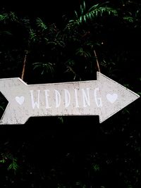 Close-up of road sign at cemetery