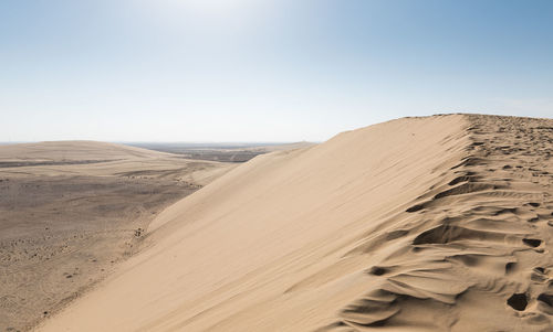 Scenic view of desert against clear sky