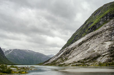 Scenic view of lake and mountains against sky