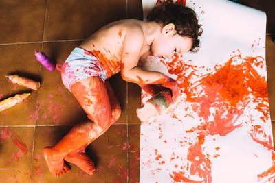 High angle view of shirtless boy at home