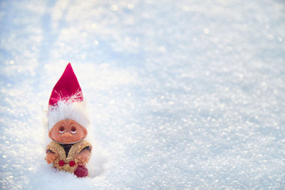 Close-up of christmas decorations on snow