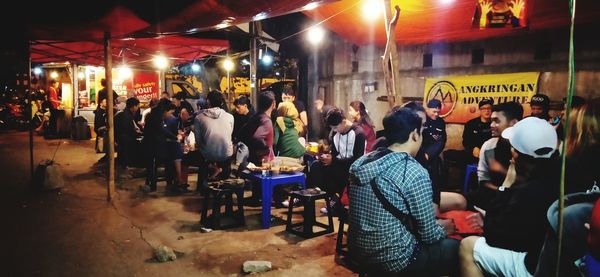 Group of people in restaurant at night