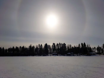 Scenic view of landscape against sky during winter