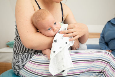 Midsection of woman holding teddy bear