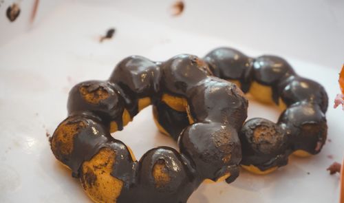 Close-up of roasted coffee beans on table