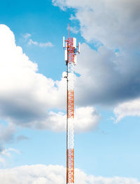 Low angle view of communications tower against sky