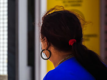 Rear view of woman looking away