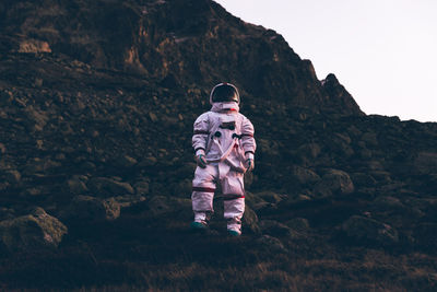 Full length of man standing on rock