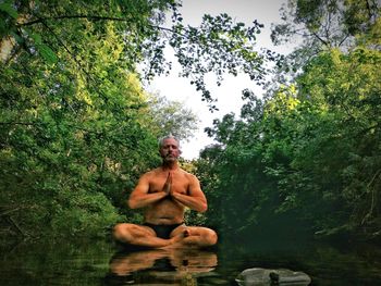 Man sitting in forest