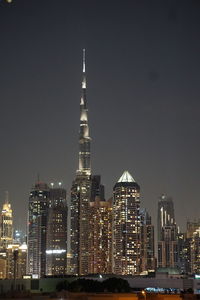 Illuminated buildings in city at night