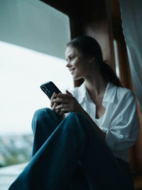 Young woman using mobile phone
