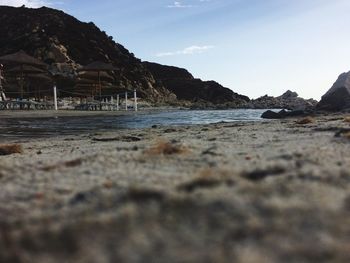 Surface level view of beach against sky