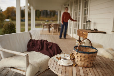 Man standing by basket on table