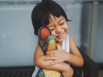 Smiling girl holding ice cream