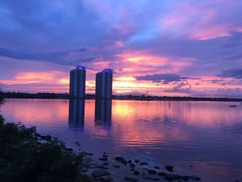Reflection of clouds in water at sunset
