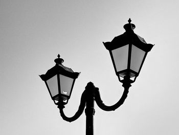 Low angle view of street light against sky