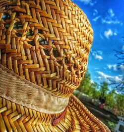 Close-up of wicker basket against sky