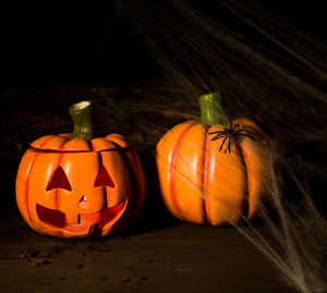 Various pumpkin on table against black background