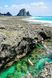 High angle view of woman swimming in sea at orchid island