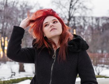 Portrait of woman standing in snow