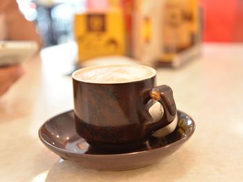 Close-up of coffee cup on table