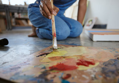 Close-up of hand painting on table