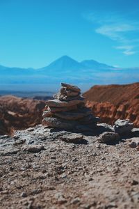 Pile of stones with mountain in background