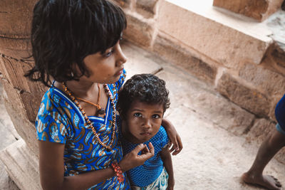 Portrait of mother and daughter outdoors